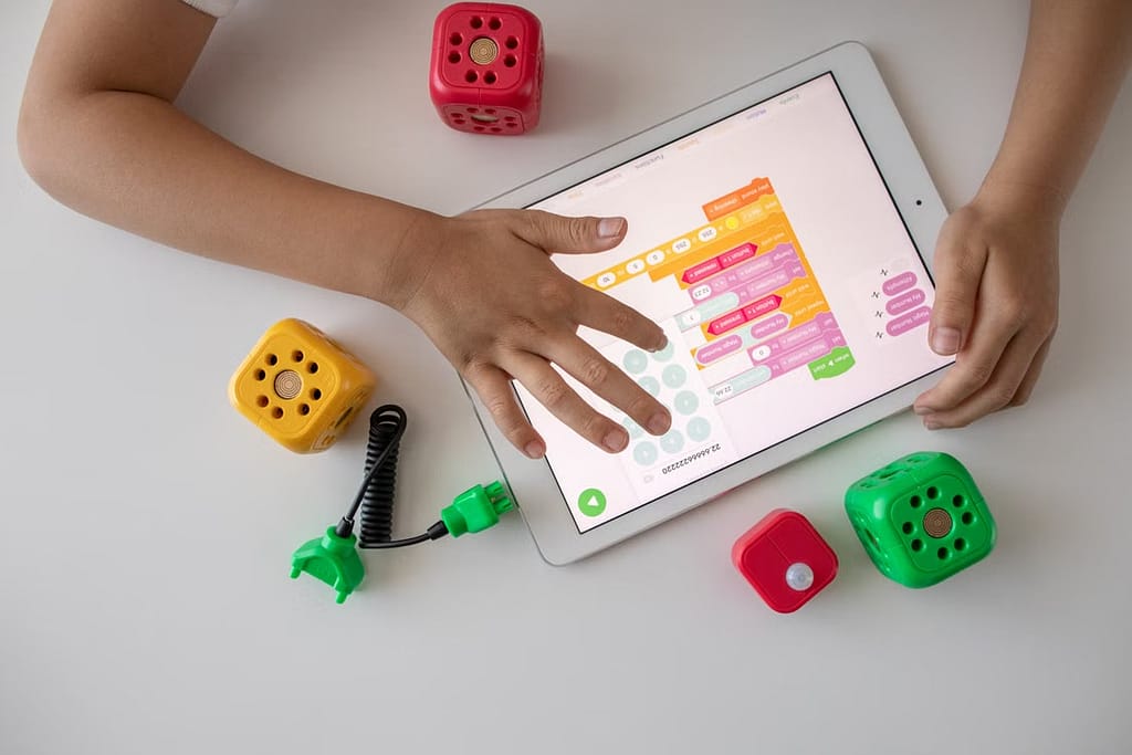 Kid learning code on ipad