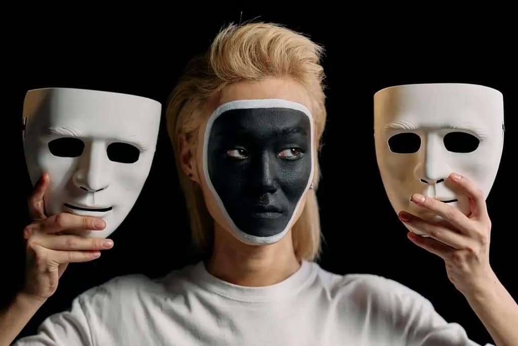 Person picking between two masks
