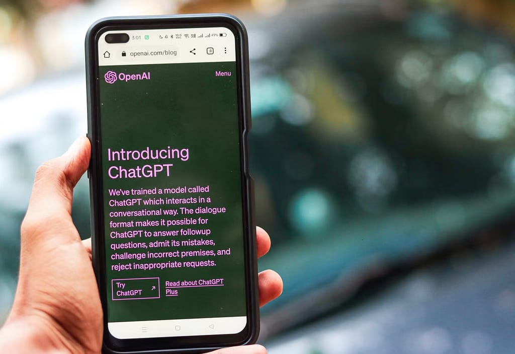 Hand holding phone with chatgpt open